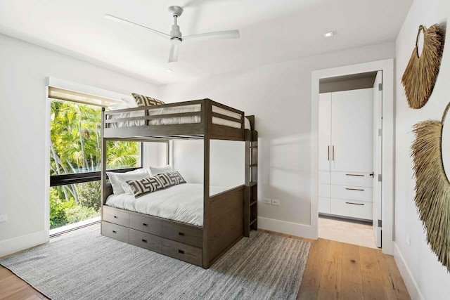 5288 Alton Rd Share B, Unit Share B, Miami Beach, FL 33140 - bedroom with baseboards, wood finished floors, and multiple windows