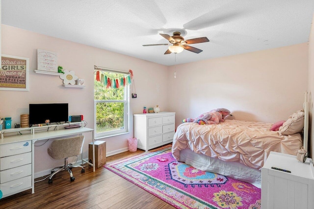 17109 81st Ln N, Loxahatchee, FL 33470 - bedroom with baseboards, a ceiling fan, a textured ceiling, and wood finished floors