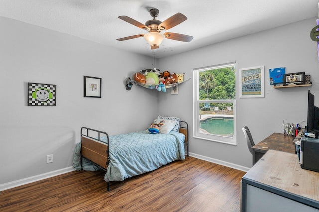 17109 81st Ln N, Loxahatchee, FL 33470 - bedroom with baseboards, a ceiling fan, and wood finished floors