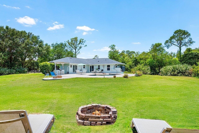 17109 81st Ln N, Loxahatchee, FL 33470 - rear view of property featuring a lawn, a patio, a fire pit, and an outdoor pool