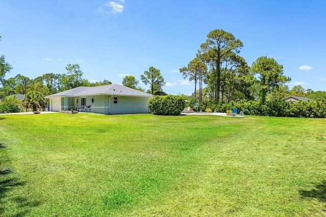 17109 81st Ln N, Loxahatchee, FL 33470 - view of yard with an attached garage and concrete driveway
