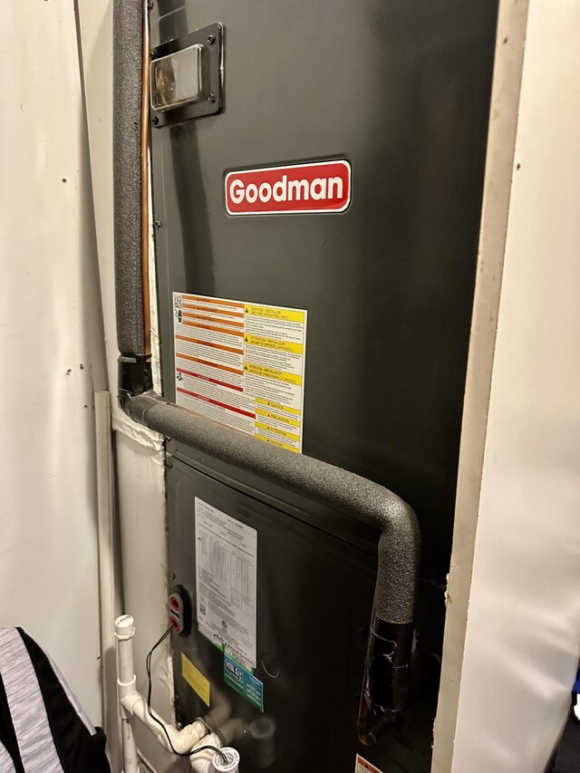 utility room with heating unit
