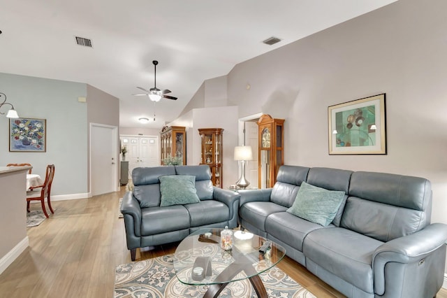 3516 Westminster Dr, Greenacres, FL 33463 - living room featuring ceiling fan, baseboards, vaulted ceiling, and light wood-style floors