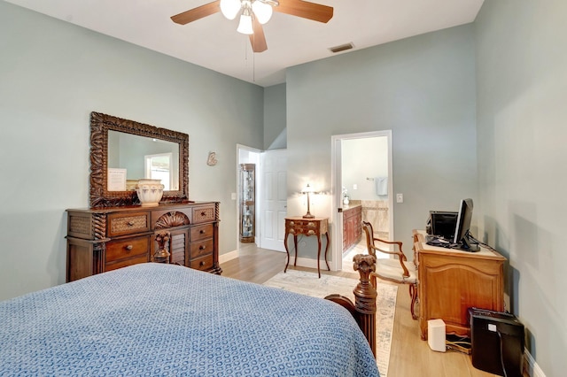 3516 Westminster Dr, Greenacres, FL 33463 - bedroom featuring light wood-style floors, baseboards, a ceiling fan, a towering ceiling, and connected bathroom