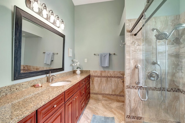 3516 Westminster Dr, Greenacres, FL 33463 - bathroom featuring tiled shower, tile walls, vanity, and wainscoting
