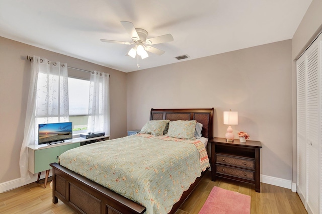 3516 Westminster Dr, Greenacres, FL 33463 - bedroom featuring a closet, light wood-style flooring, baseboards, and a ceiling fan