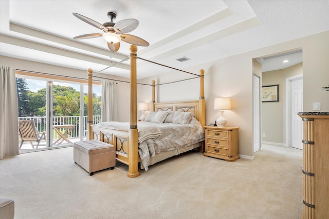 6616 NW 56th Dr, Coral Springs, FL 33067 - bedroom featuring light colored carpet, access to exterior, baseboards, a tray ceiling, and a textured ceiling
