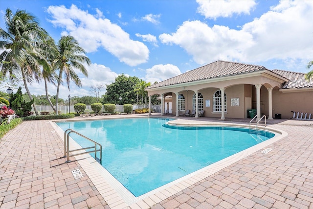 6616 NW 56th Dr, Coral Springs, FL 33067 - community pool featuring fence and a patio