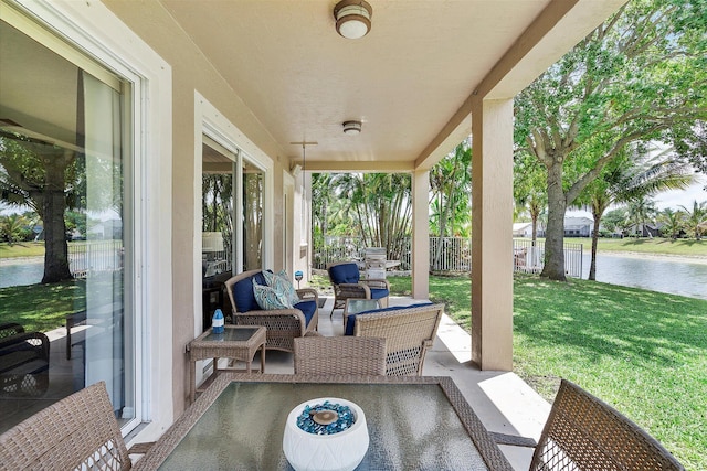 6616 NW 56th Dr, Coral Springs, FL 33067 - view of patio / terrace with a water view and an outdoor hangout area