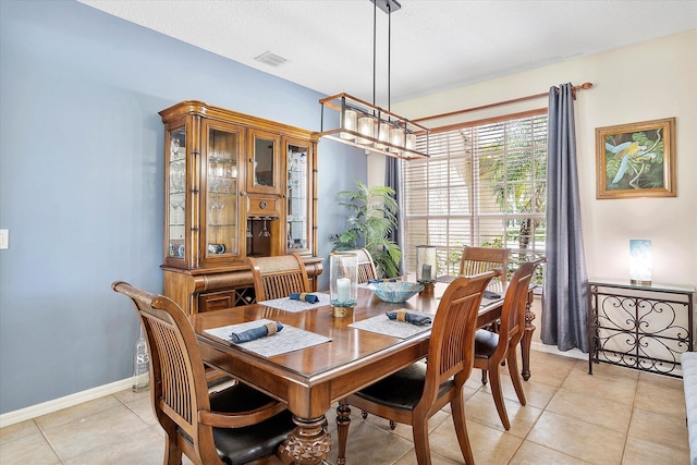 6616 NW 56th Dr, Coral Springs, FL 33067 - dining room with baseboards and light tile patterned floors