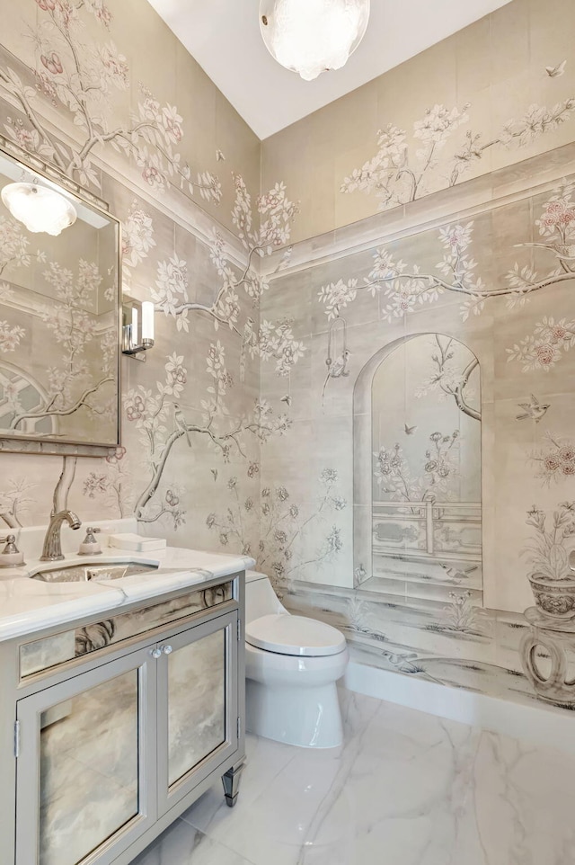 20155 Boca W Dr Unit Phc902, Boca Raton, FL 33434 - bathroom with toilet, vanity, marble finish flooring, and wallpapered walls