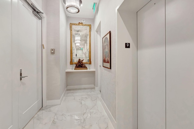 20155 Boca W Dr Unit Phc902, Boca Raton, FL 33434 - hall featuring elevator, baseboards, and light marble finish flooring
