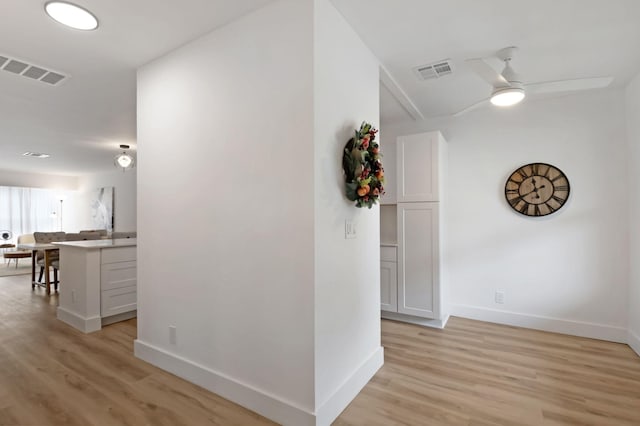 1150 Boxwood Dr Unit 203, Delray Beach, FL 33445 - hall featuring baseboards, visible vents, and light wood-style floors