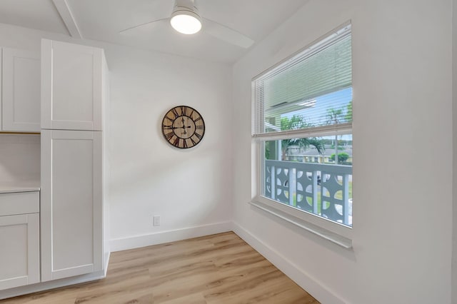 1150 Boxwood Dr Unit 203, Delray Beach, FL 33445 - unfurnished dining area with baseboards, a ceiling fan, light wood-style floors, and a wealth of natural light