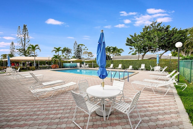1150 Boxwood Dr Unit 203, Delray Beach, FL 33445 - community pool featuring fence and a patio area