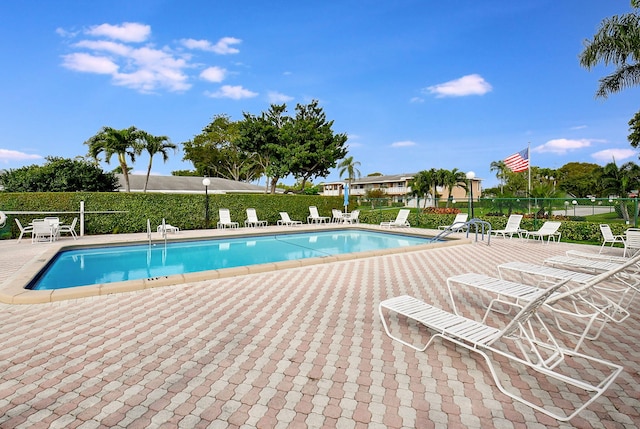 1150 Boxwood Dr Unit 203, Delray Beach, FL 33445 - community pool with a patio area and fence