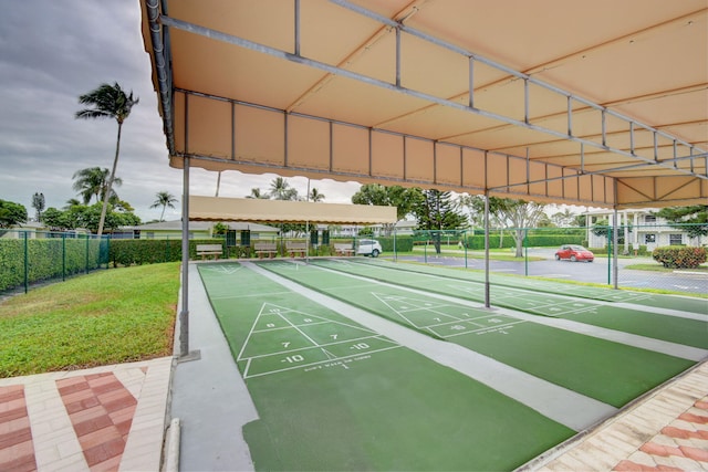 1150 Boxwood Dr Unit 203, Delray Beach, FL 33445 - view of home's community featuring fence, a yard, and shuffleboard