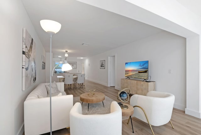 1150 Boxwood Dr Unit 203, Delray Beach, FL 33445 - living room with baseboards and light wood-style flooring