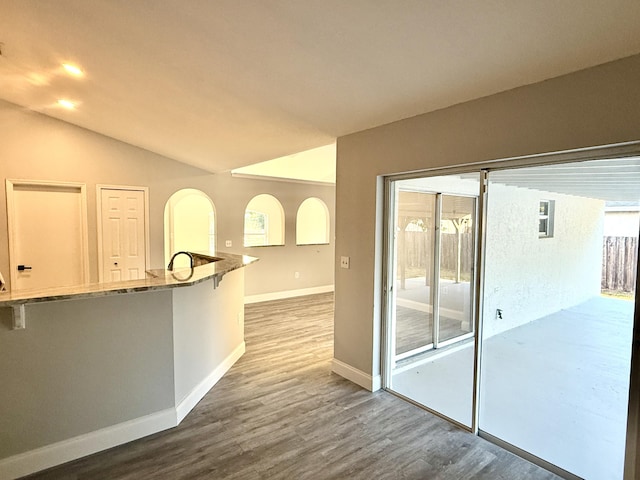 673 SW Granadeer St, Port Saint Lucie, FL 34983 - unfurnished room with lofted ceiling, baseboards, and wood finished floors