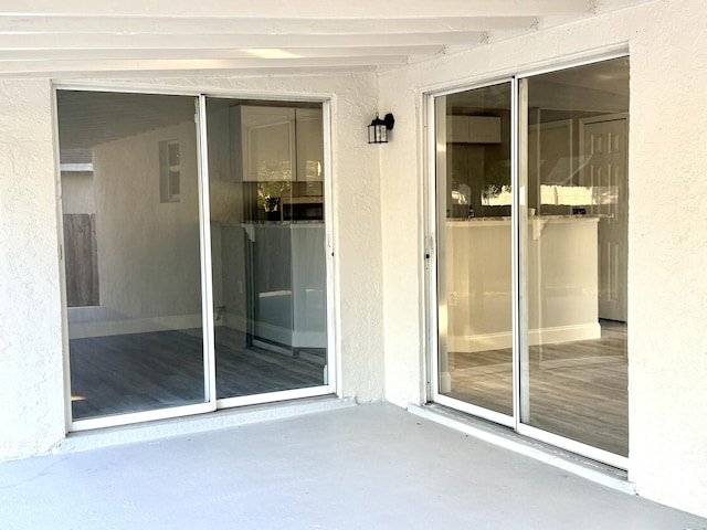 673 SW Granadeer St, Port Saint Lucie, FL 34983 - property entrance featuring a patio area and stucco siding