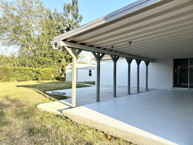 673 SW Granadeer St, Port Saint Lucie, FL 34983 - view of patio with a shed, an outbuilding, and an attached carport