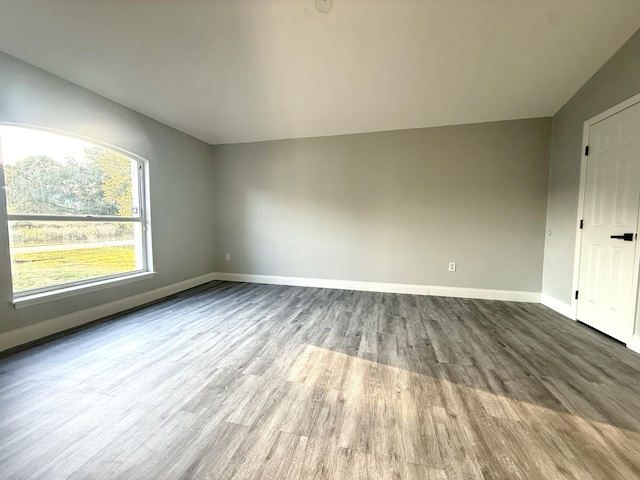 673 SW Granadeer St, Port Saint Lucie, FL 34983 - interior space featuring baseboards and wood finished floors