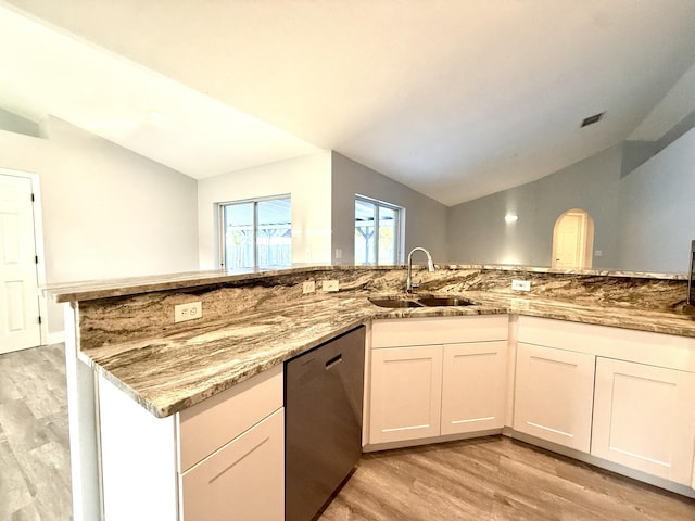 673 SW Granadeer St, Port Saint Lucie, FL 34983 - kitchen featuring dishwasher, light wood-style floors, vaulted ceiling, and a sink