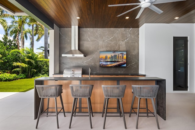 view of patio with exterior kitchen, grilling area, and ceiling fan