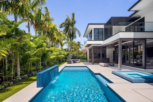 outdoor pool featuring an outdoor hangout area, an in-ground hot tub, a patio area, and ceiling fan