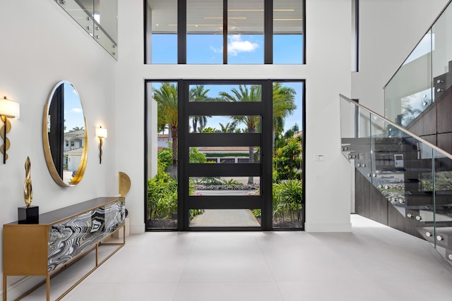 entrance foyer with a high ceiling and stairway