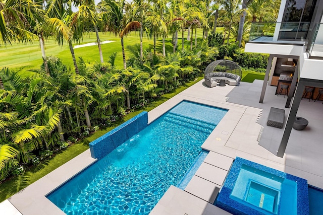 outdoor pool with an outdoor living space, a patio area, an in-ground hot tub, and a yard