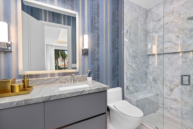 full bath with a stall shower, toilet, and vanity