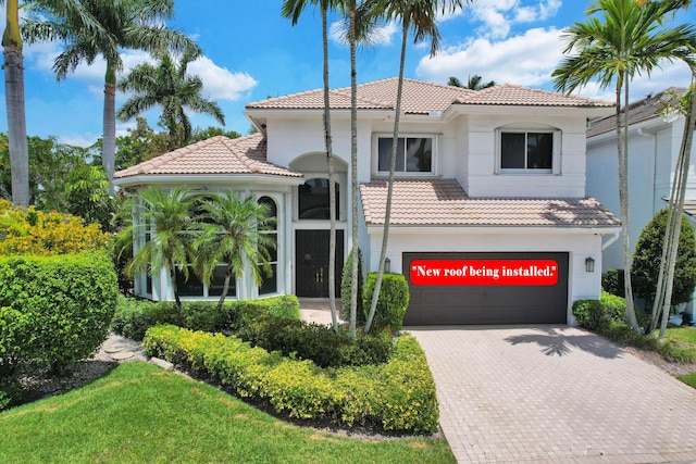 4132 NW 55th Pl, Boca Raton, FL 33496 - mediterranean / spanish-style home with a tile roof, a garage, and decorative driveway