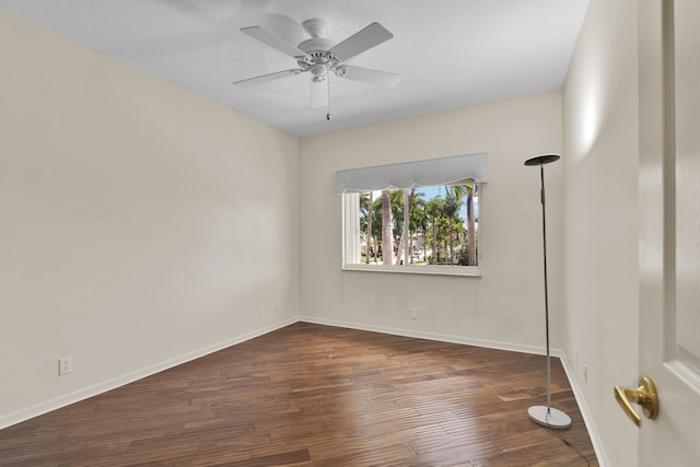 unfurnished room with baseboards, ceiling fan, and wood finished floors
