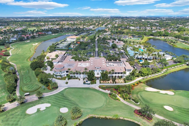 birds eye view of property featuring a water view and golf course view