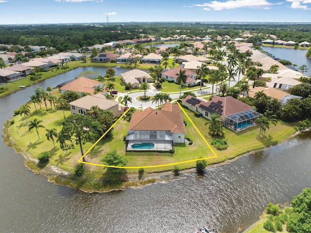 bird's eye view with a water view and a residential view