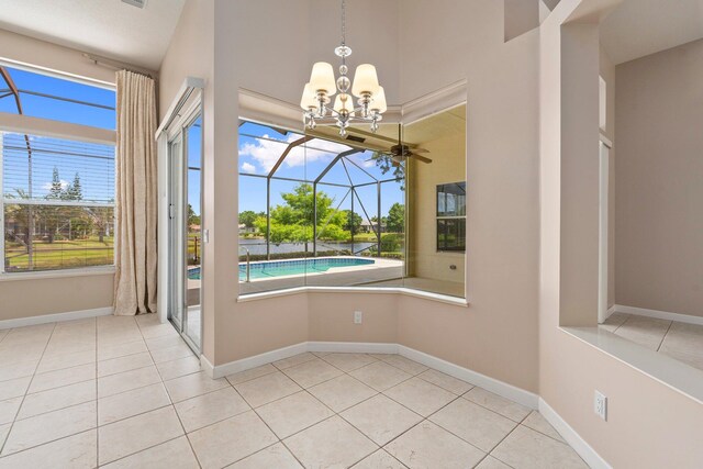 unfurnished dining area featuring tile patterned flooring, a sunroom, and a healthy amount of sunlight