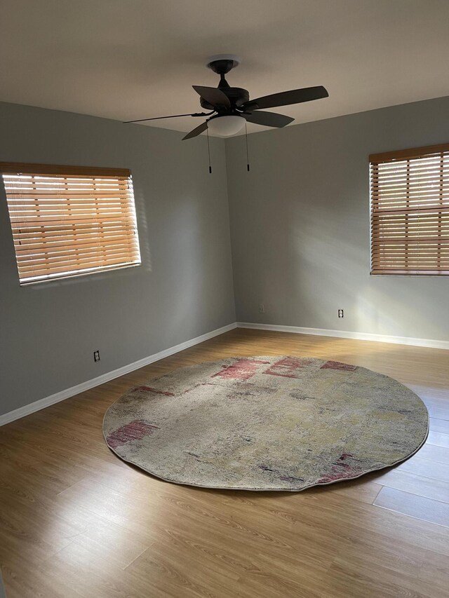 4237 Oak Terrace Dr, Greenacres, FL 33463 - spare room featuring baseboards, plenty of natural light, and wood finished floors