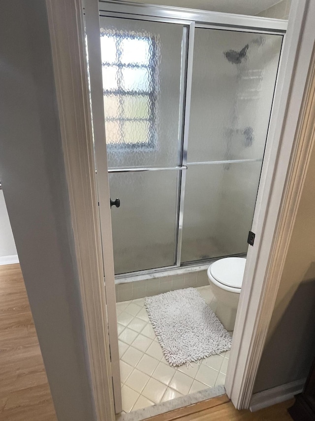 4237 Oak Terrace Dr, Greenacres, FL 33463 - full bath with toilet, a shower stall, and wood finished floors