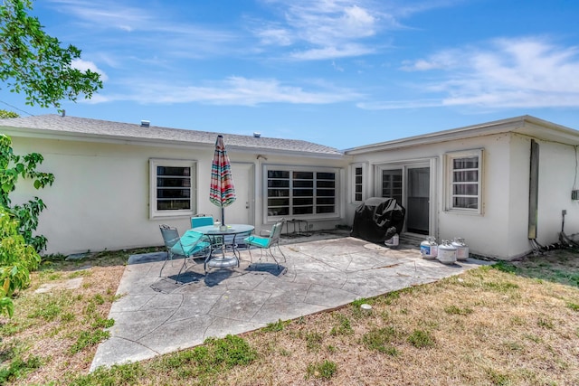 431 Virginia Dr, Lake Worth Beach, FL 33461 - rear view of house with a patio and stucco siding