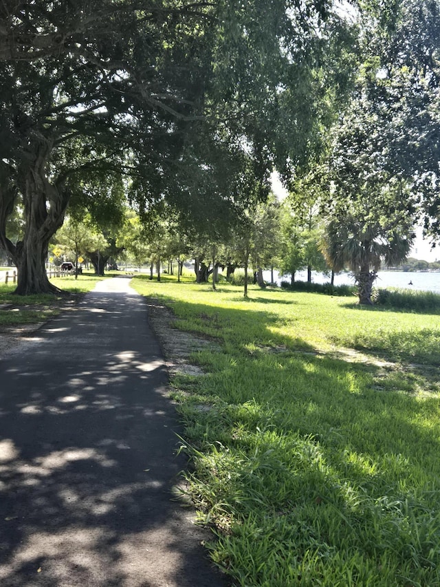431 Virginia Dr, Lake Worth Beach, FL 33461 - view of community featuring driveway and a yard