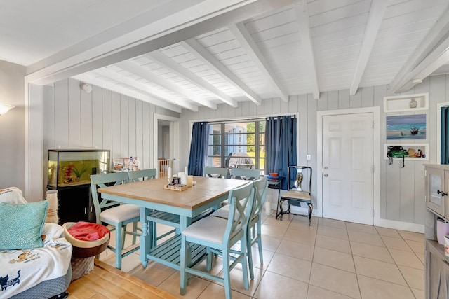 431 Virginia Dr, Lake Worth Beach, FL 33461 - dining space with beam ceiling, light tile patterned floors, wooden walls, and wooden ceiling