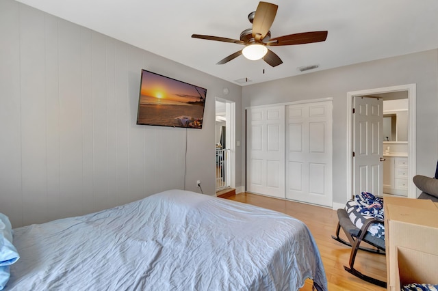 431 Virginia Dr, Lake Worth Beach, FL 33461 - bedroom featuring light wood-style flooring, a closet, ceiling fan, and ensuite bathroom