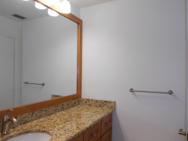 bathroom featuring visible vents and vanity