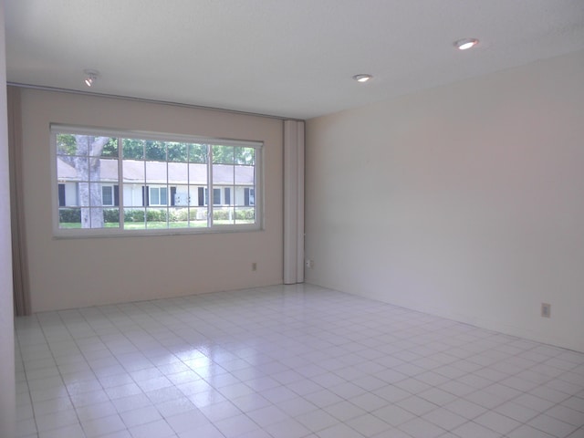 empty room featuring recessed lighting