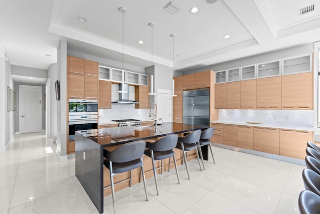 10715 Estuary Dr, Parkland, FL 33076 - kitchen with a kitchen breakfast bar, visible vents, appliances with stainless steel finishes, modern cabinets, and wall chimney exhaust hood