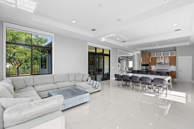 10715 Estuary Dr, Parkland, FL 33076 - living room featuring recessed lighting, a tray ceiling, and ornamental molding