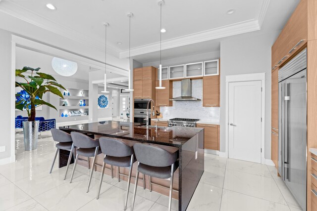 10715 Estuary Dr, Parkland, FL 33076 - kitchen with modern cabinets, brown cabinets, wall chimney range hood, and a kitchen bar