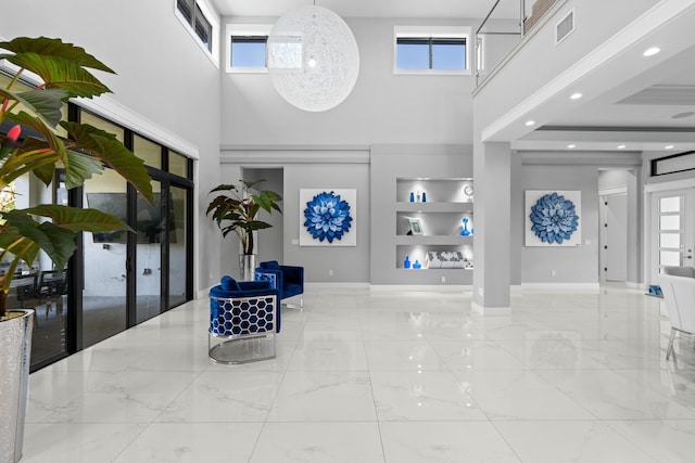 10715 Estuary Dr, Parkland, FL 33076 - entryway with plenty of natural light, baseboards, a high ceiling, and visible vents