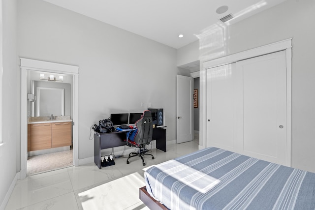 10715 Estuary Dr, Parkland, FL 33076 - bedroom with visible vents, a sink, baseboards, a closet, and marble finish floor